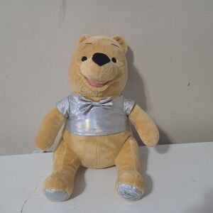 Disney 100th Celebration Exclusive Winnie The Pooh plush toy. 